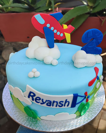 Boy with Aeroplane Cake